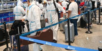 Vaccination, not travel curbs, key to battling Omicron – WHO