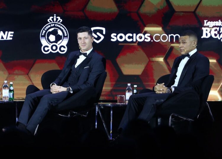 Bayern Munich's Robert Lewandowski and Paris St Germain's Kylian Mbappe during the Globe Soccer Awards at the Burj Khalifa, Dubai.