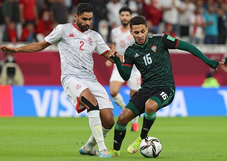 UAE forward Ali Saleh battles for ball with Tunisia's Bilel Ifa in the Fifa Arab Cup match in Doha on Monday, December 6, 2021.