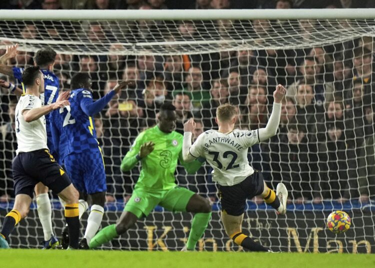 Everton's Jarrad Branthwaite (R) scores his side's first goal during their English Premier League match against Chelsea in London.