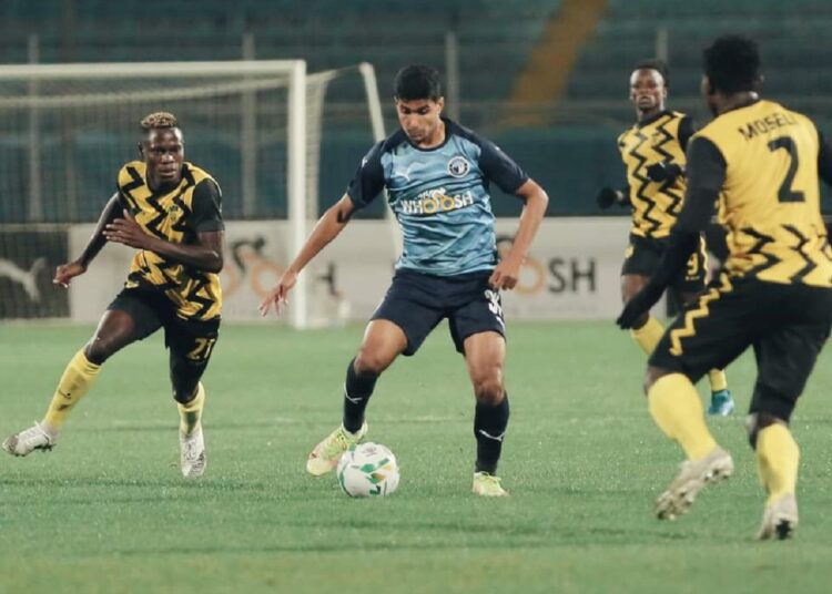 Pyramids’ striker Ibrahim Adel (C) vying for the ball against DR Congo’s AS Maniema Union defender during their match at the CAF Confederation Cup in Cairo.