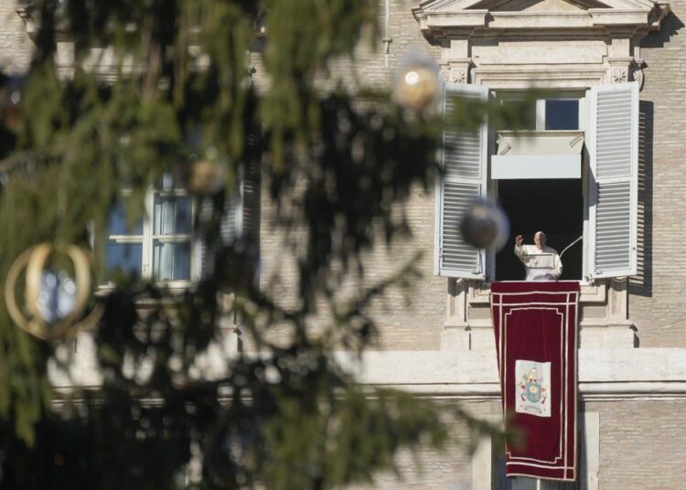Pope tells abused mother domestic violence ‘nearly satanic’ 1 - Egyptian Gazette Pope Francis, framed by a Christmas tree, waves to faithful as he delivers the Angelus noon prayer in St. Peter's Square at the Vatican, on Sunday, December 19, 2021.