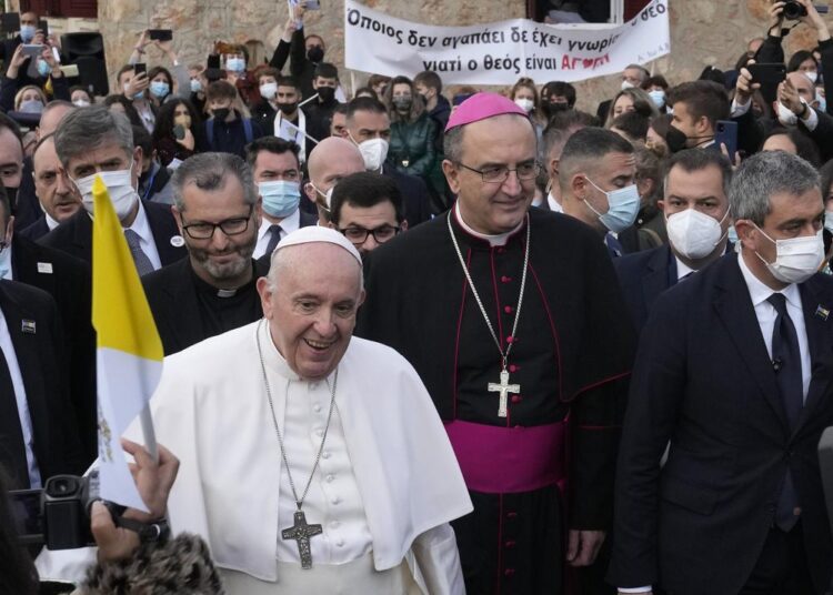 Pope Francis arrives for a meeting with young people at the Saint Dionysius School of the Ursuline Sisters in Athens, Greece, on Monday, December 6, 2021.
