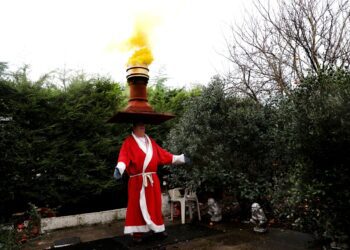 Head-balancing British strongman on record mission for 75th birthday