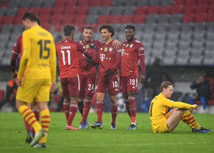 Bayern Munich's Leroy Sane celebrates scoring their second goal against Barcelona with teammates at the Allianz Arena, Munich.