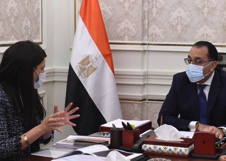 Prime Minister Moustafa Madbouli during his meeting on Sunday with Minister of International Co-operation Rania el-Mashat.
