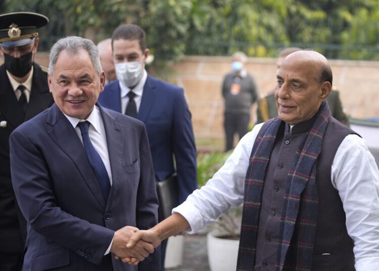 India hosts Putin as it balances ties with Russia, US 1 - Egyptian Gazette Indian Defence Minister Rajnath Singh, right, shakes hand with his Russian counterpart Sergey Shoygu in New Delhi, India, on Monday, December 6, 2021.