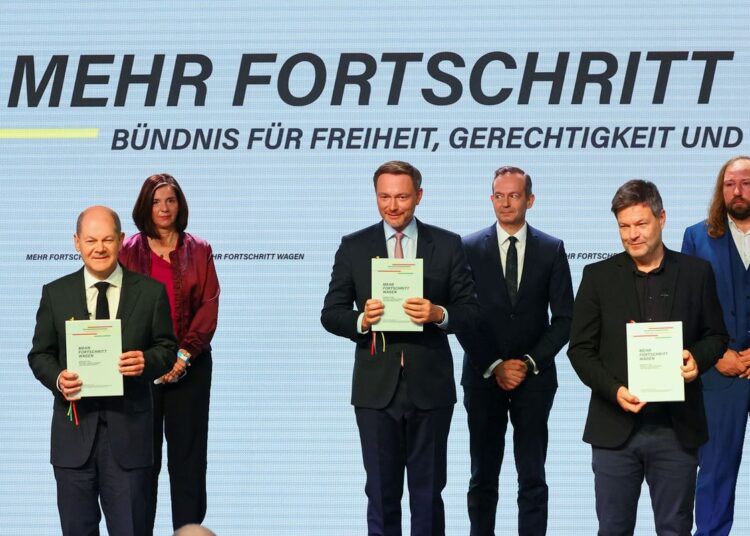 Designated German Chancellor Olaf Scholz of the Social Democratic Party (SPD); Robert Habeck, Anton Hofreiter and Katrin Goering-Eckardt of Germany's Green Party; and Christian Lindner and Volker Wissing of the Free Democratic Party (FDP) stand on stage during the signing ceremony of a coalition government agreement at the "Futurium - the house of futures" museum in Berlin, Germany, December 7, 2021.