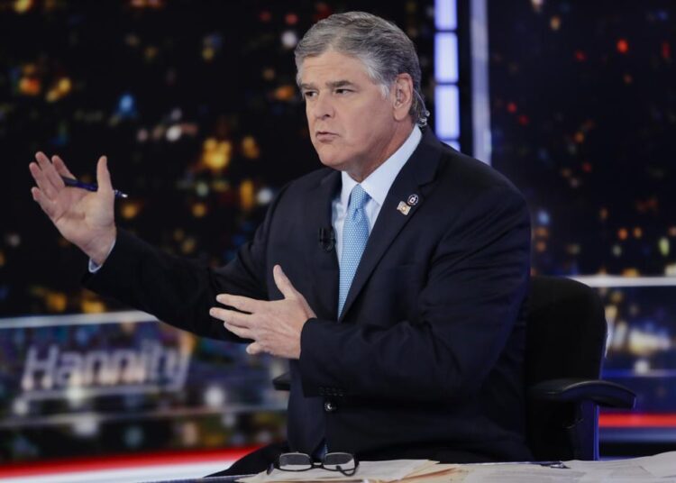 FILE - Fox News host Sean Hannity speaks during a taping of his show, "Hannity," on Aug. 7, 2019, in New York. The revelation that Fox News Channel personalities sent text messages to the White House during the Jan. 6 insurrection urging President Donald Trump to call off the attack is the latest example of the network's stars seeking to influence the actions of newsmakers instead of simply reporting the news.