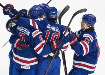 Defending champ US holds off Slovakia to open world juniors