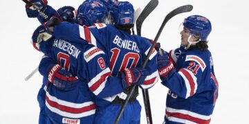 Defending champ US holds off Slovakia to open world juniors