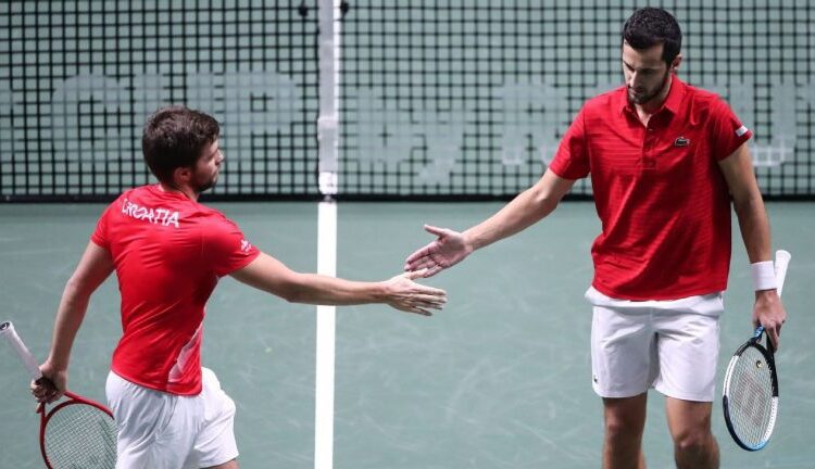 Djokovic fails to steer Serbia into Davis Cup final as Croatia progress 1 - Egyptian Gazette Croatia's Nikola Mektic and Mate Pavic react during their match against Serbia's Novak Djokovic and Nikola Cacic in Madrid.