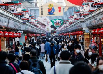 Japan braces for Omicron spread as New Year’s travellers fan across country