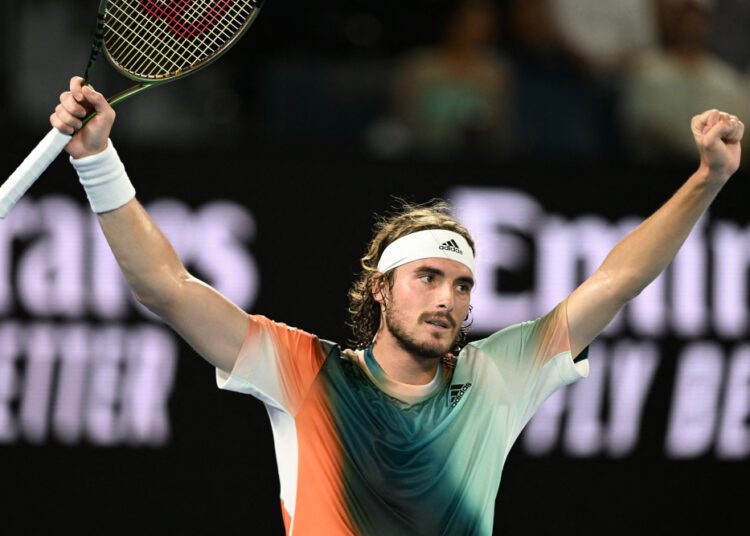 Greece's Stefanos Tsitsipas celebrates after beating Italy's Jannik Sinner in their men's singles quarter-final match on day ten of the Australian Open tennis tournament in Melbourne on January 26, 2022. (Photo by MICHAEL ERREY / AFP) / -- IMAGE RESTRICTED TO EDITORIAL USE - STRICTLY NO COMMERCIAL USE --