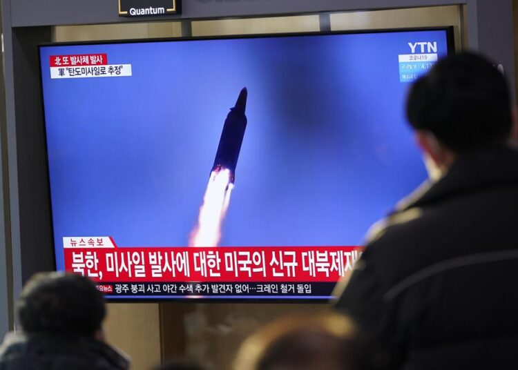 N. Korea fires fresh missiles in response to US sanctions 1 - Egyptian Gazette People watch a TV screen showing a news program reporting about North Korea's missile launch with a file image, at a train station in Seoul, South Korea, Friday, Jan. 14, 2022.