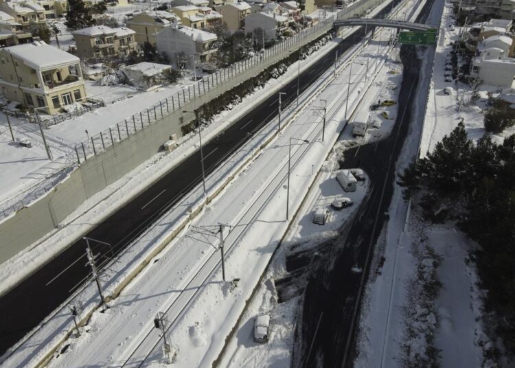 Abandoned vehicles are seen in an motorway way after a snowstorm, in Athens, on Tuesday, Jan. 25, 2022. Army and fire service teams were deployed late Monday to extract hundreds of motorists trapped for hours in snowed-in cars. A snowstorm of rare severity disrupted road and air traffic Monday in the Greek capital of Athens and neighboring Turkey's largest city of Istanbul, while most of Greece, including — unusually — several Aegean islands, and much of Turkey were blanketed by snow.
