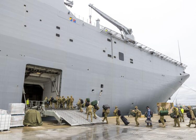 Australia navy ship with infected crew offloads aid to Tonga 1 - Egyptian Gazette In this photo provided by the Australian Defense Force, soldiers load onto HMAS Adelaide at the Port of Brisbane before departing for Tonga Thursday, Jan. 20, 2022, after a volcano eruption. Nearly two dozen sailors aboard the Adelaide have tested positive for the coronavirus, officials said Tuesday, Jan 25, 2022, raising fears they could bring the disease to Tonga which has so far managed to avoid any outbreaks.