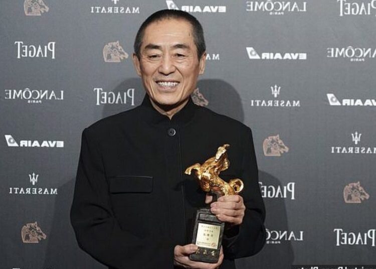Filmmaker Zhang Yimou returns for Olympics opening ceremony 1 - Egyptian Gazette Chinese director Zhang Yimou holds his award for Best Director at the 55th Golden Horse Awards on Nov. 17, 2018.