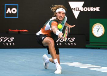 Swearing Tsitsipas pushed all the way to reach third round