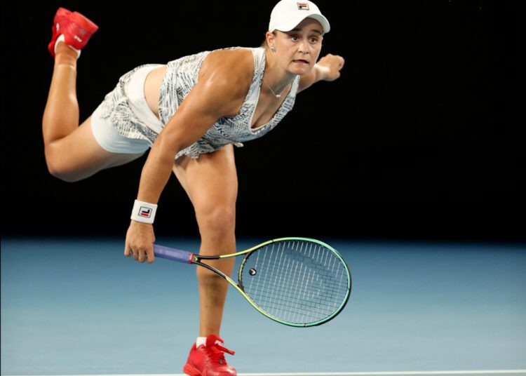 Australia's Ashleigh Barty serves against Madison Keys of the US during their women's singles semi-final match on day eleven of the Australian Open tennis tournament in Melbourne on January 27, 2022. (Photo by Martin KEEP / AFP) / -- IMAGE RESTRICTED TO EDITORIAL USE - STRICTLY NO COMMERCIAL USE --