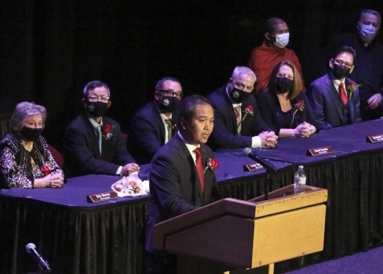 Mayor Sokhary Chau addresses the assembly during the Lowell City Council swearing-in ceremony, on Monday, January 3, 2022, in Lowell, Mass., held at Lowell Memorial Auditorium due to the Covid-19 pandemic.