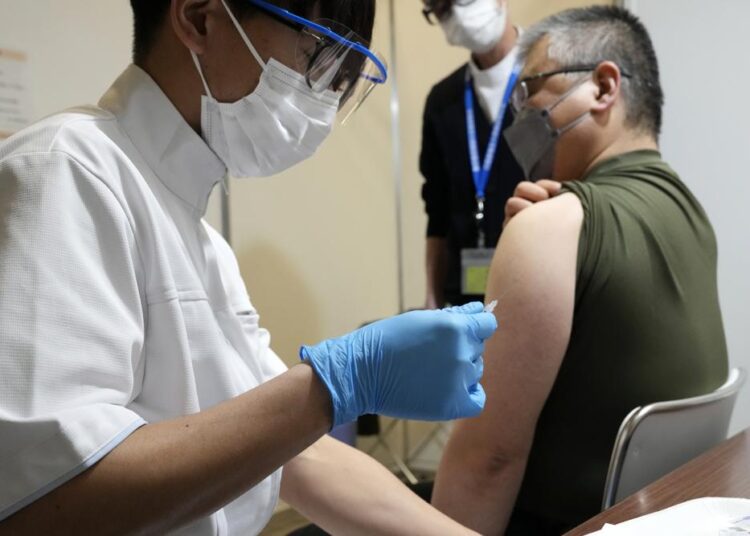 Japan starts mass Covid boosters as Omicron cases soar 1 - Egyptian Gazette