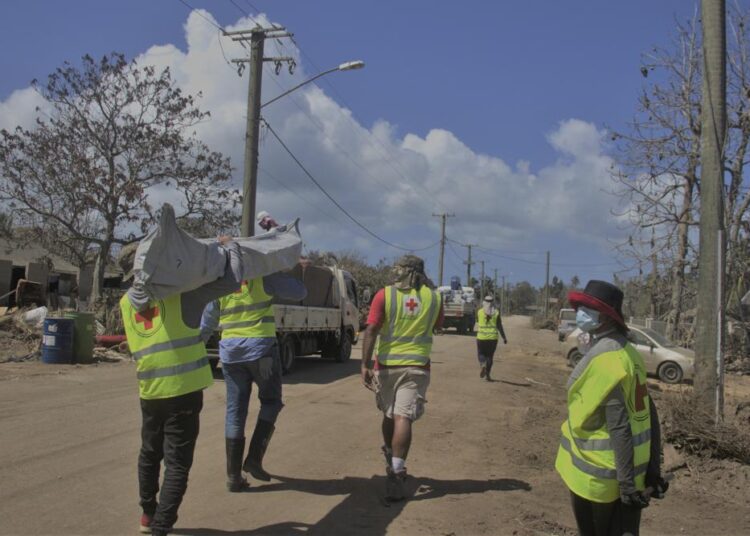 4 Japanese planes fly more aid to Tonga after volcanic blast 1 - Egyptian Gazette Red Cross teams deliver essential relief items such as tarpaulins, shelter tool kits and blankets to families in Kanokupolu, western Tongatapu, on January 21, 2022, as the Tonga island group grapples with the aftermath from the recent underwater volcanic eruption.