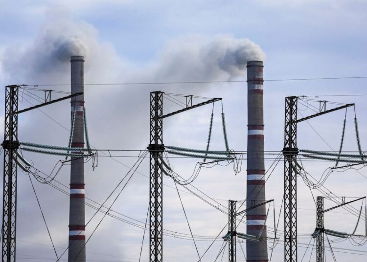 Pylons of high-tension electricity power lines are seen next to the GRES-1 coal-fired thermal power plant outside the town of Ekibastuz, Kazakhstan November 7, 2021.