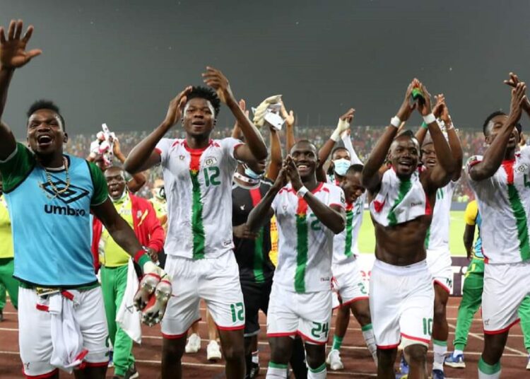Burkina Faso players celebrate after defeating Tunisia in an African Cup of Nations quarter-final match in Garoua.