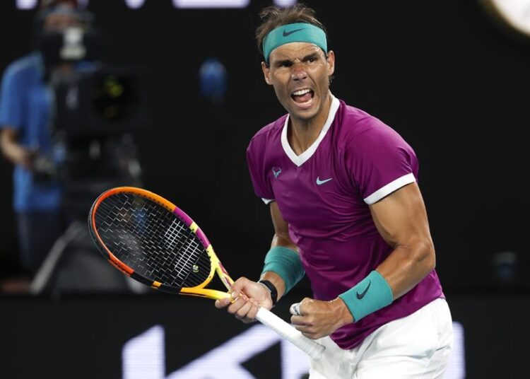 Rafael Nadal of Spain reacts after winning the first set against Matteo Berrettini of Italy during their semi-final match at the Australian Open in Melbourne, Australia, Friday, Jan. 28, 2022.
