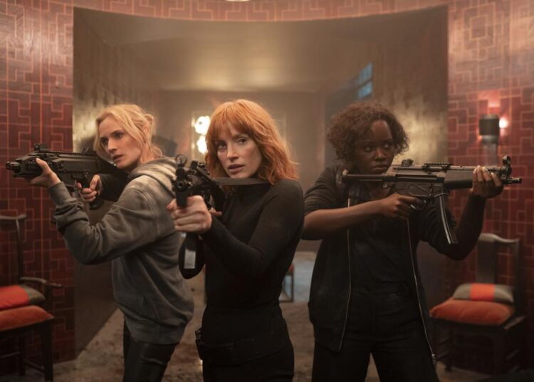 This image provided by Universal Pictures shows Diane Kruger, from left, Jessica Chastain and Lupita Nyong'o from the film "The 355."