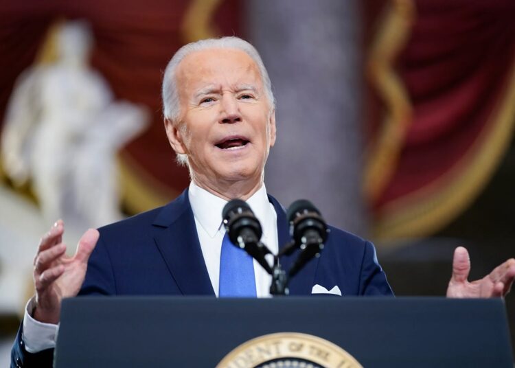 President Joe Biden speaks from Statuary Hall at the US Capitol to mark the one year anniversary of the Jan. 6 riot at the US Capitol by supporters loyal to then-President Donald Trump, on Jan. 6, 2022, in Washington.