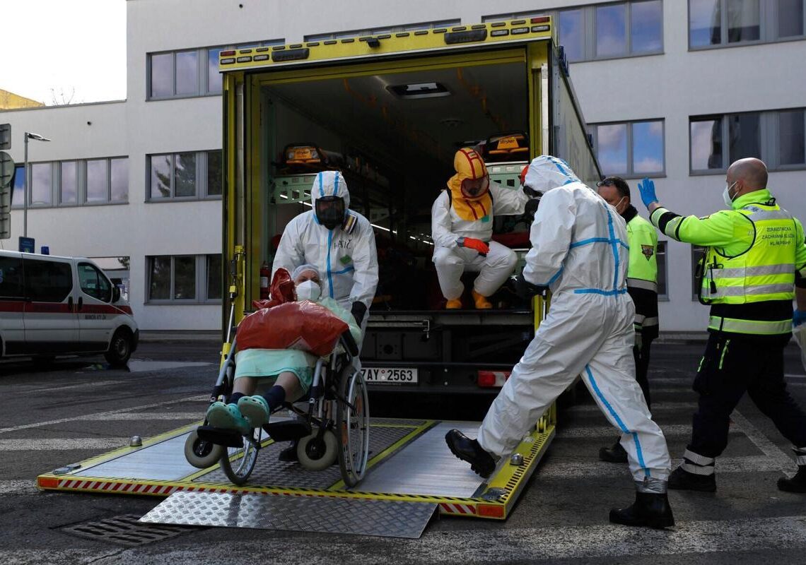 Czechs to let some workers stay on after testing positive 1 - Egyptian Gazette A file photo shows health care workers transport a COVID-19 patient, in Ceska Lipa, Czech Republic, on March 18, 2021.