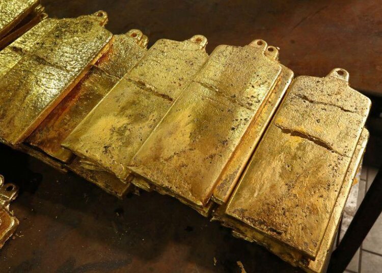 Gold hovered near its two-month highs on Friday as inflation and geopolitical risks underpinned the safe-haven metal.