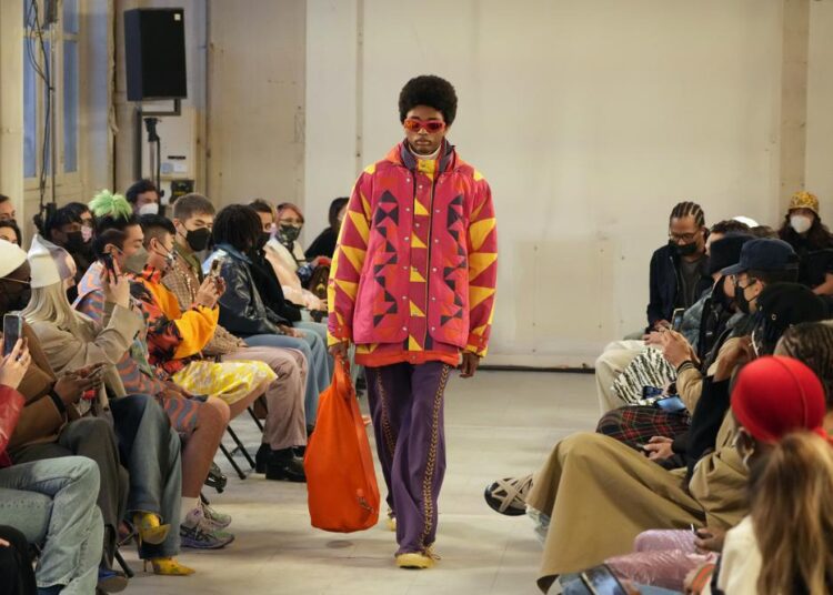 Emerging talents in spotlight at hybrid Paris Fashion Week 1 - Egyptian Gazette A model wears a creation for the Bluemarble fall-winter 22/23 men's collection, in Paris, Tuesday, Jan. 18, 2022.