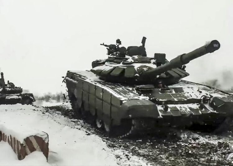 In this photo taken from video provided by the Russian Defense Ministry Press Service yesterday, a Russian tanks roll during a military exercising at a training ground in Rostov region, Russia.