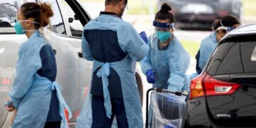 Australia’s daily Covid-19 infections dip below 100,000