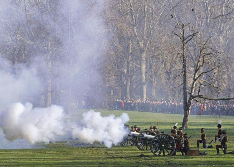 Members of the King's Troop, Royal Horse Artillery fire a gun salute in Green Park, to mark the official start of the Platinum Jubilee, in London, Monday, Feb. 7, 2022.