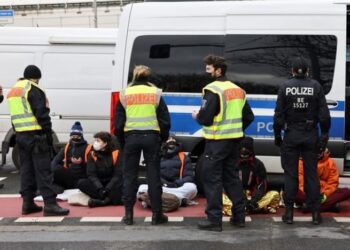 Group of 11 climate activists glue themselves to Berlin motorway