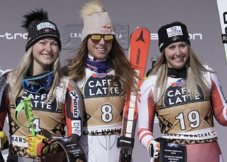 From left, second placed Norway's Ragnhild Mowinckel, the winner, Czech Republic's Ester Ledecka and third placed Austria's Cornelia Huetter, celebrate after an alpine ski, women's World Cup downhill race, in Crans-Montana, Switzerland.