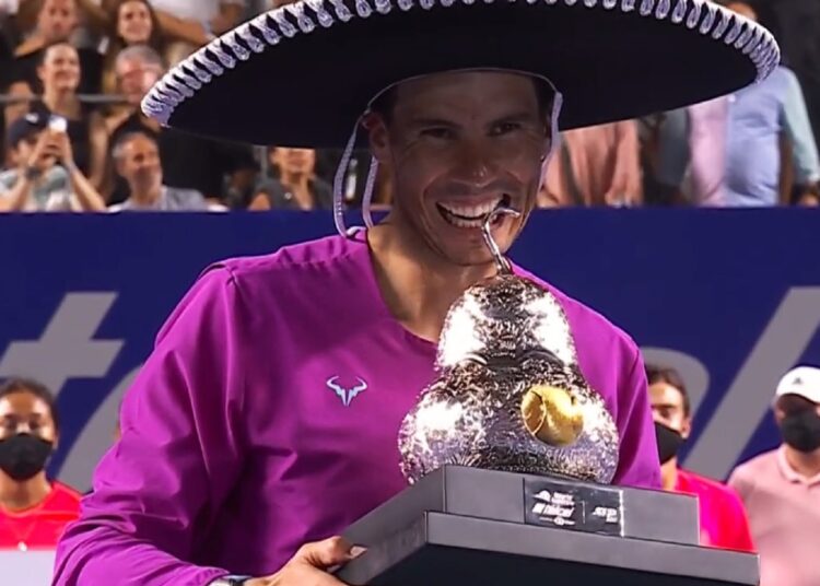 Rafael Nadal poses with the Mexican Open trophy in Acapulco.