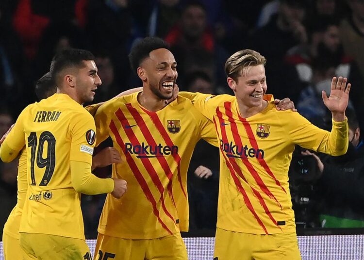 Barcelona’s Gabonese midfielder Pierre-Emerick Aubameyang (C) celebrates with teammates after scoring his team’s fourth goal during the UEFA Europa League knockout round play-off second leg match against Napoli in Naples.
