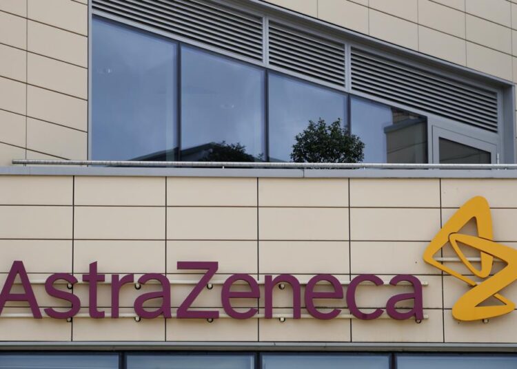 FILE - A general view of AstraZeneca offices and the corporate logo in Cambridge, England, Saturday, July 18, 2020. AstraZeneca has recorded a big jump in revenue as it begins to take a profit from its coronavirus vaccine for the first time. The company recorded full-year revenues of $37.4 billion, an increase of 38% from the year before at constant exchange rates. Part of the boost came from $4 billion in sales of its COVID-19 vaccine, developed with the University of Oxford. Despite rising revenue, AstraZeneca reported a pre-tax loss of $265 million due to costs from its purchase of U.S. drug company Alexion Pharmaceuticals and new drug research.