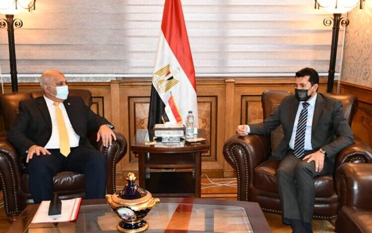 Egyptian Minister of Youth and Sports Ashraf Sobhy during his meeting with head of the Egyptian Shooting Federation Hazem Hosny.
