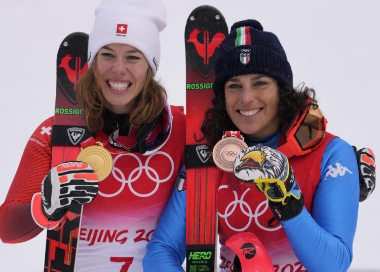 World ski body cancels all upcoming events in Russia 1 - Egyptian Gazette Michelle Gisin of Switzerland, gold (L) and Federica Brignone of Italy, bronze, celebrate after the medal ceremony for the women's combined at the 2022 Winter Olympics, in the Yanqing district of Beijing.