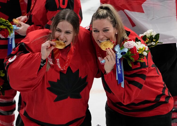 Canada beats US to reclaim Olympic women's hockey supremacy 1 - Egyptian Gazette Canada goalkeeper Emerance Maschmeyer (L) and Natalie Spooner pose with their gold medals after defeating the United States during the women's gold medal hockey game at the 2022 Winter Olympics in Beijing.