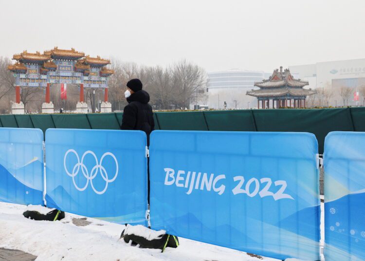 Sports set to start at Beijing Winter Olympics but controversies weigh heavy 1 - Egyptian Gazette A security guard stands near the closed loop "bubble" at the Main Press Center ahead of the Beijing 2022 Winter Olympics in Beijing, China January 23, 2022. REUTERS/Tyrone Siu