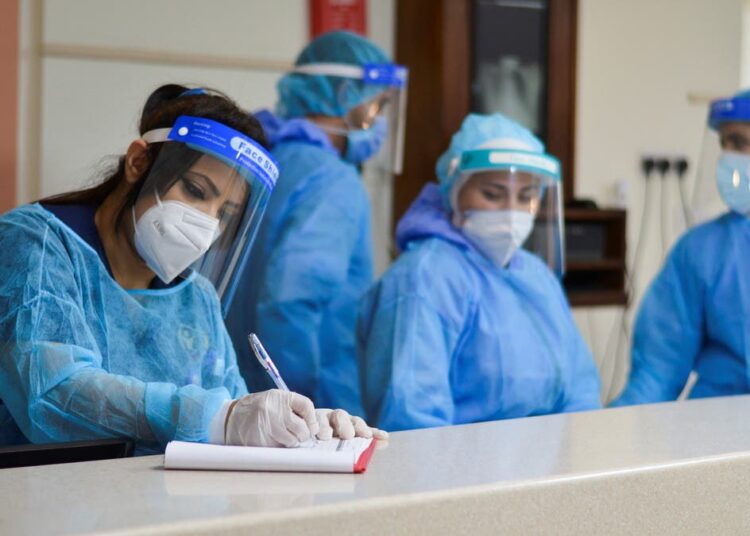 Jordan to lift COVID restrictions on international visitors 1 - Egyptian Gazette A file photo showing medical staff members wearing protective gear work at a section for patients suffering from COVID-19 inside a hospital in Amman, Jordan on March 23, 2021.