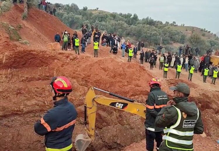 People use machinery to excavate the ground in order to free a boy trapped in an underground well, in Chefchaouen, Morocco, February 4, 2022, in this screen grab obtained from a social media video.
