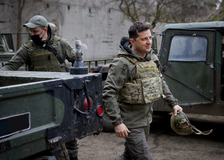 FILE PHOTO: FILE PHOTO: Ukraine's President Volodymyr Zelenskiy visits positions of armed forces near the frontline with Russian-backed separatists in Donbass region, Ukraine April 9, 2021. Ukrainian Presidential Press Service/Handout via REUTERS ATTENTION EDITORS - THIS IMAGE WAS PROVIDED BY A THIRD PARTY./File Photo/File Photo